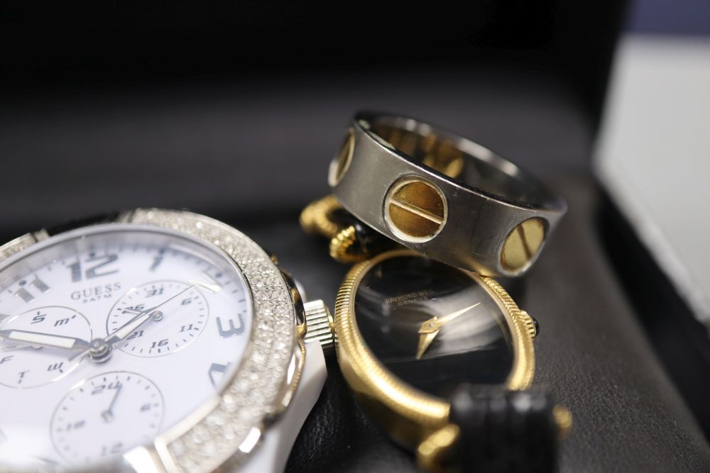 Two watches- Guess & Raymond Weil and a ring.
